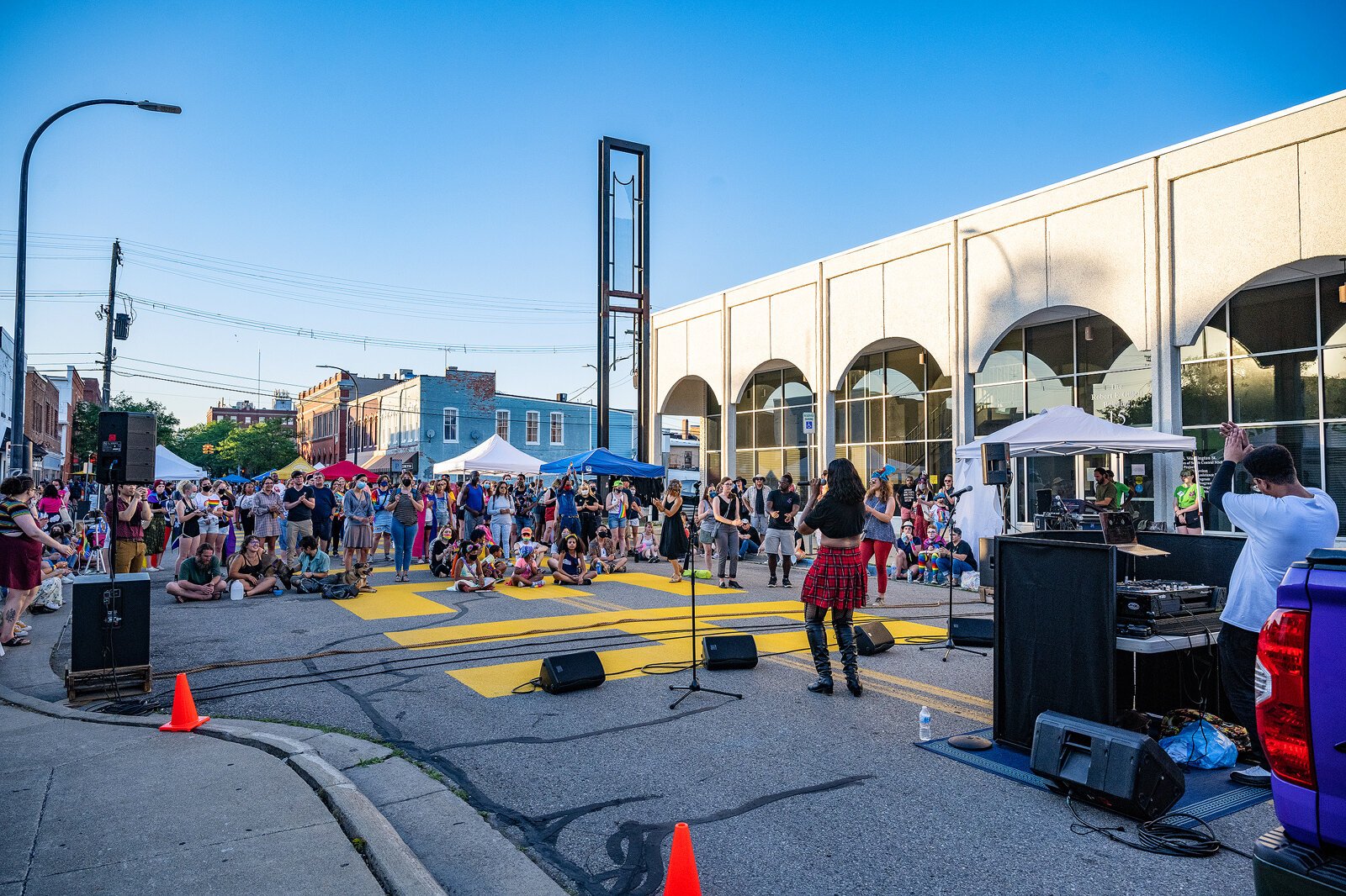 London Beck performs on S Washington St in Ypsilanti for Ann Arbor Summer Festival.