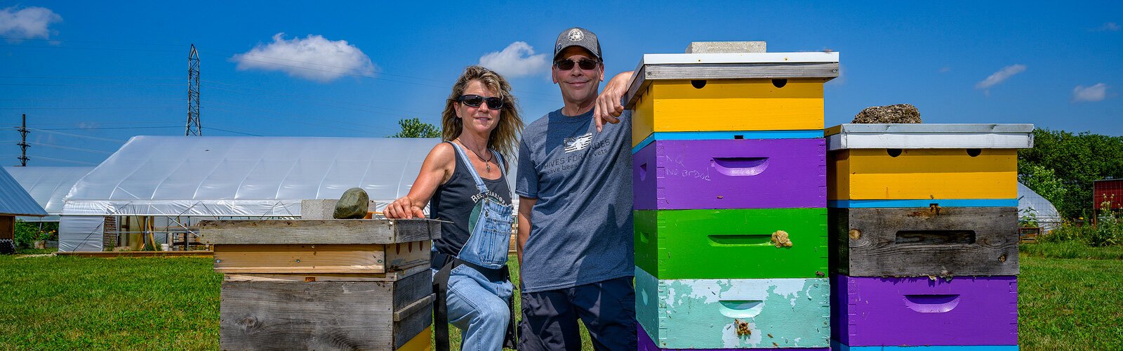 Cecilia Infante and Eric Spalding with bee hives at The Farm at St. Joe.