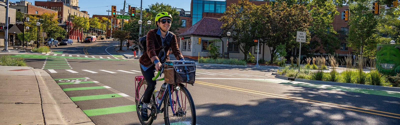 Jade Marks riding her bike on the West Liberty Street bike lane in Ann Arbor.
