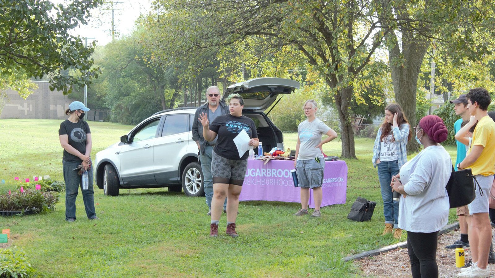 Organizer Tajalli Hodge directs volunteers at Sugarbrook Park.