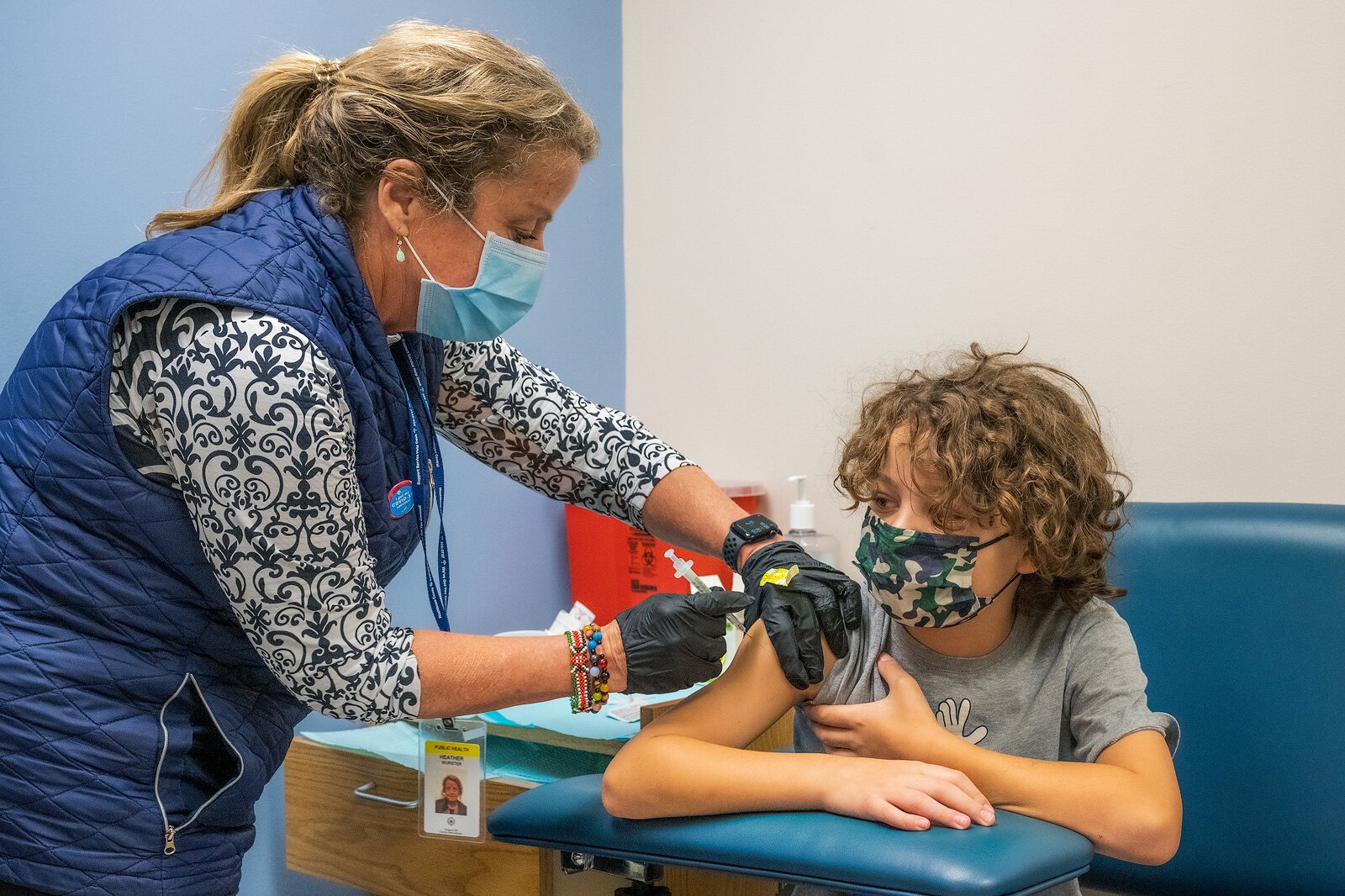 Pierre Boisseron-Kamp receives his first vaccine shot at the Washtenaw County Health Department.