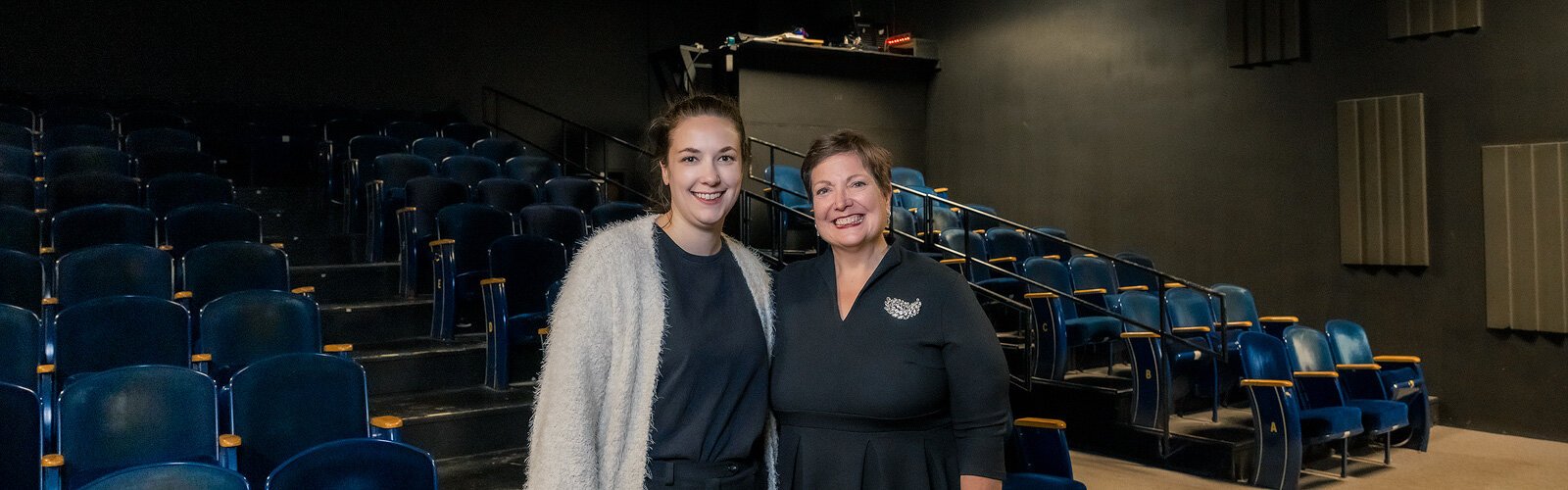 RAC Manager of Operations Maggie Spencer and Executive Director Amy Fracker in the theater at RAC.