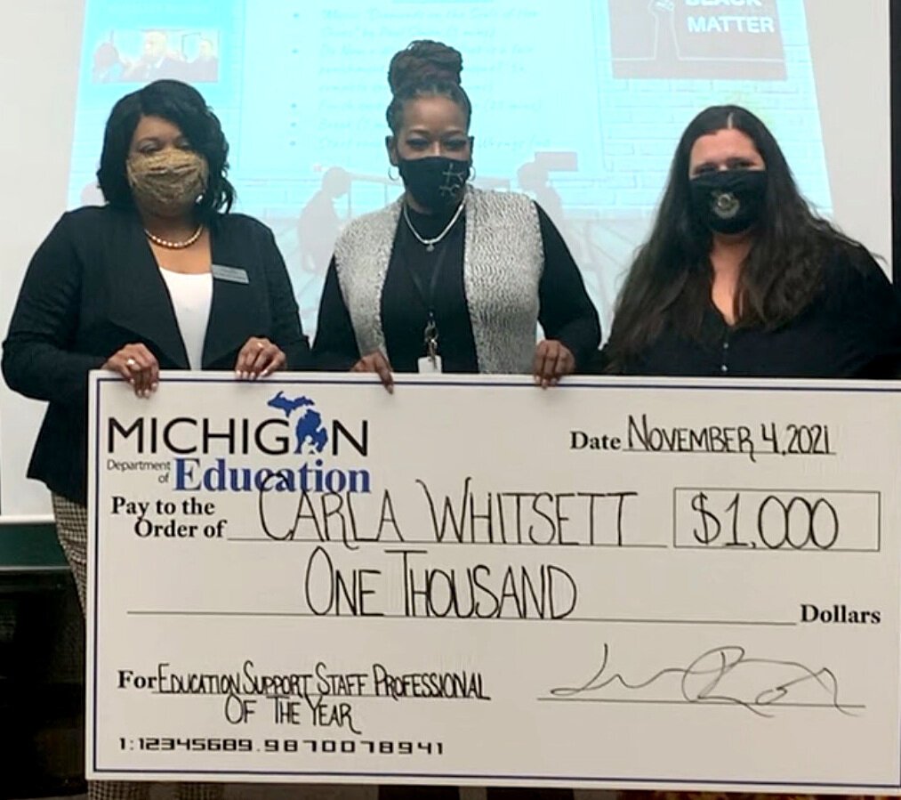 Better Me Youth founder Carla Whitsett accepts the state of Michigan's Support Staff Professional of the Year award.