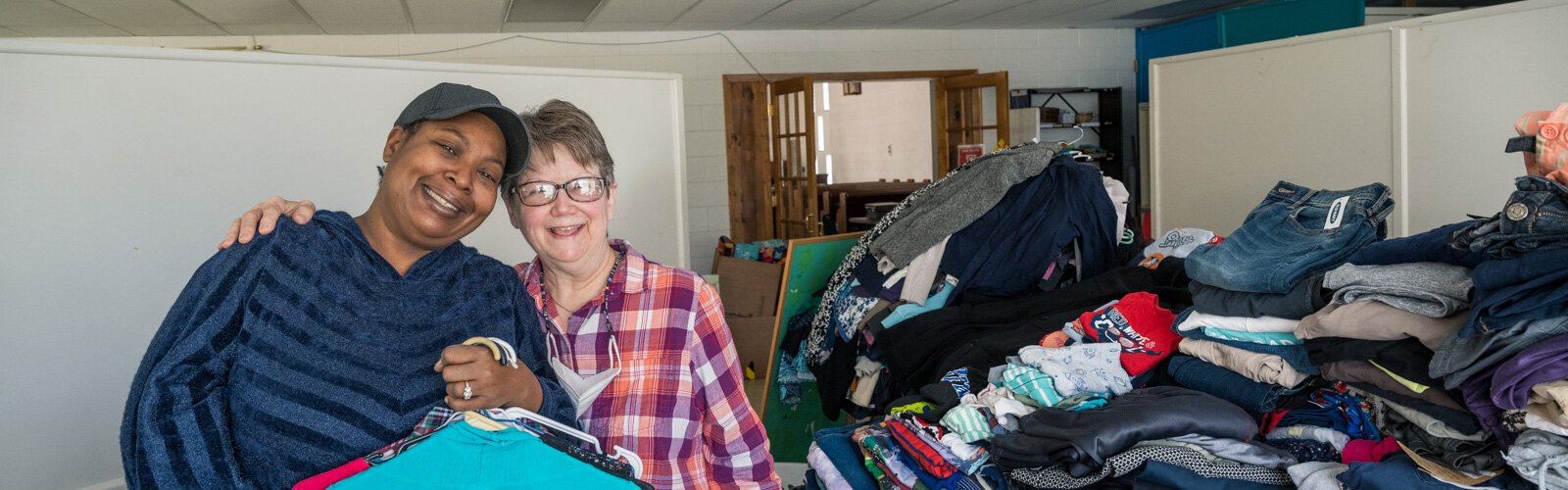 Shonne Draw and Bunny Arbaugh process donations at Auntie Yvonne's Community Free Store.