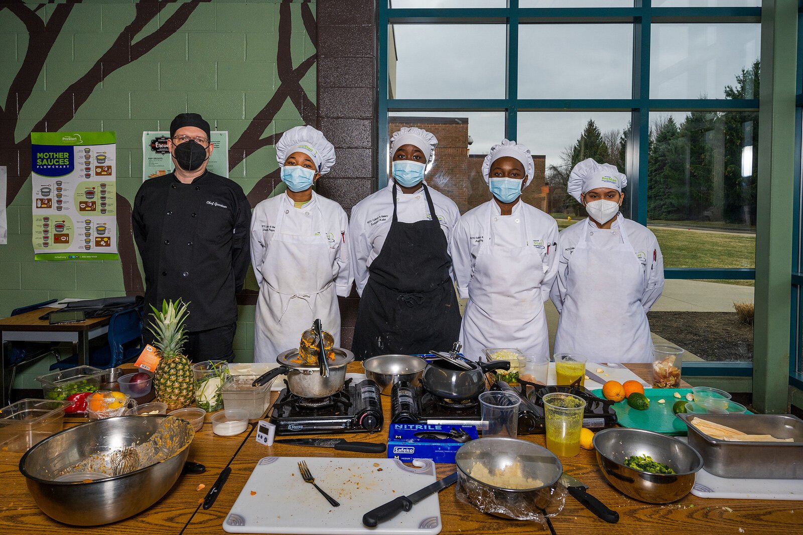 Chef Aaron Gaertner and Ypsilanti Community High School students at the RCTC culinary arts program.