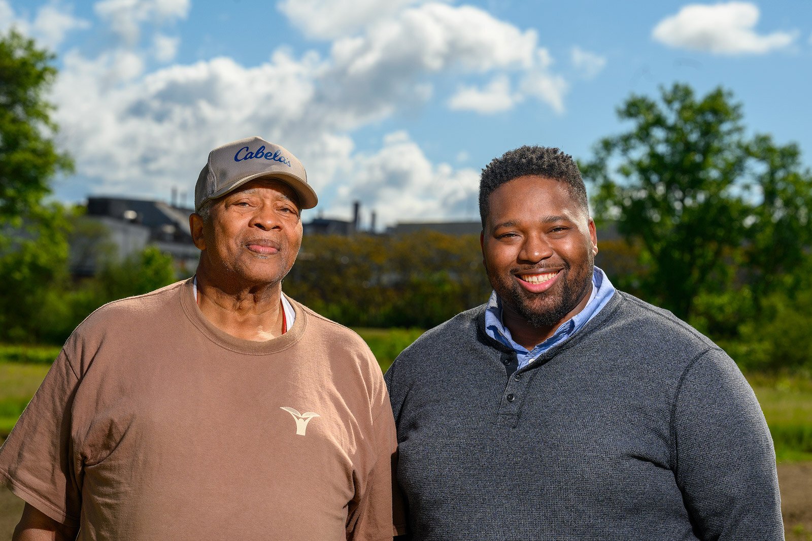 Pastor Nathaniel Crout and his son Pastor David Crout of New Covenant Missionary Baptist Church by the church's gardens.