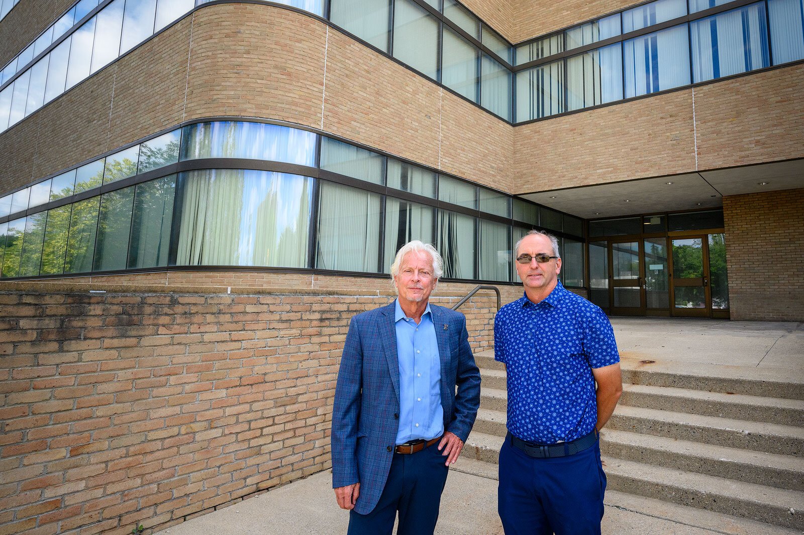 EMU Vice President for Communications Walter Kraft and MI-HQ President Mark Smith.