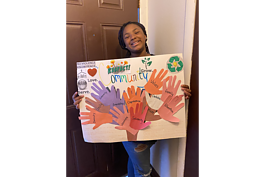 Autumn Crump holds her poster.