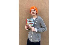 Student Elijah Wynn with one of his favorite books from the "Captain Underpants" series. The series has been frequently banned across the U.S.