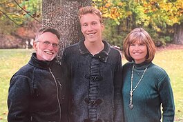 Mikhail Wisman, now 25, was adopted from Russia. He's pictured here with his adoptive parents.