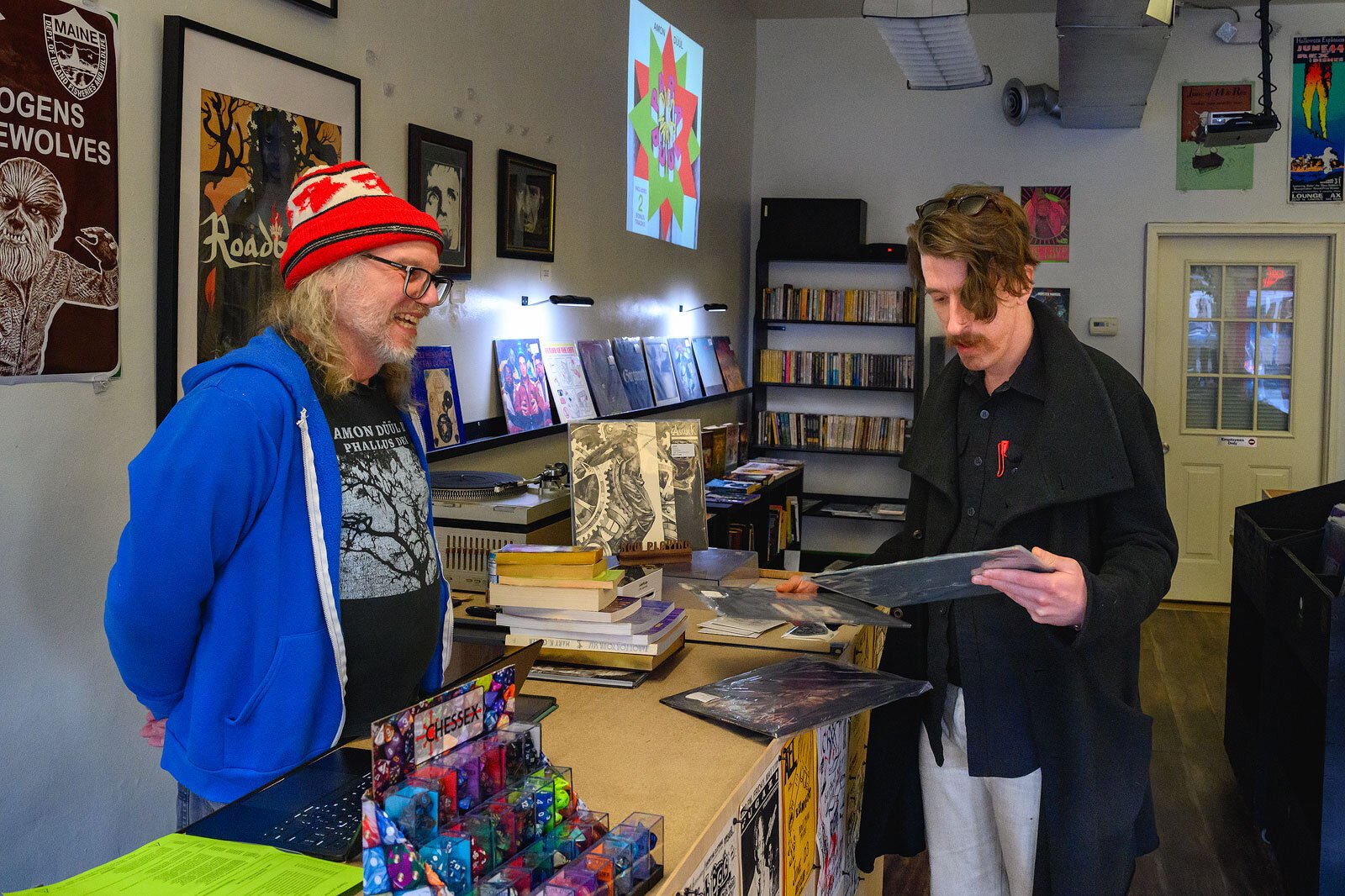 Wyrd Byrd owner Shawn Gates with a customer.