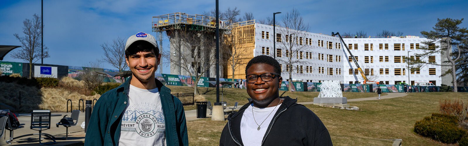 Auryon Azar and Cedrick Charles in front of the future New Lakeview Apartments at EMU.