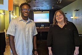 Whatabout Theatre Vice President Daniel Jackson and President Michelle Weiss setting up for Whatabout Theatre's first event on September 10, 2022.