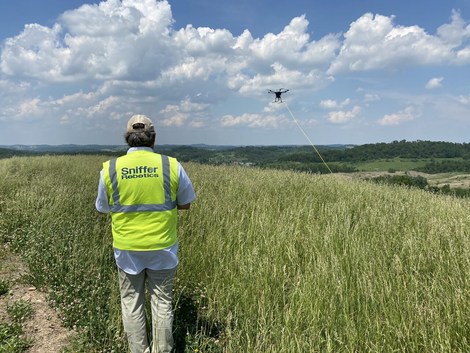 A technician operates a Sniffer Robotics drone.