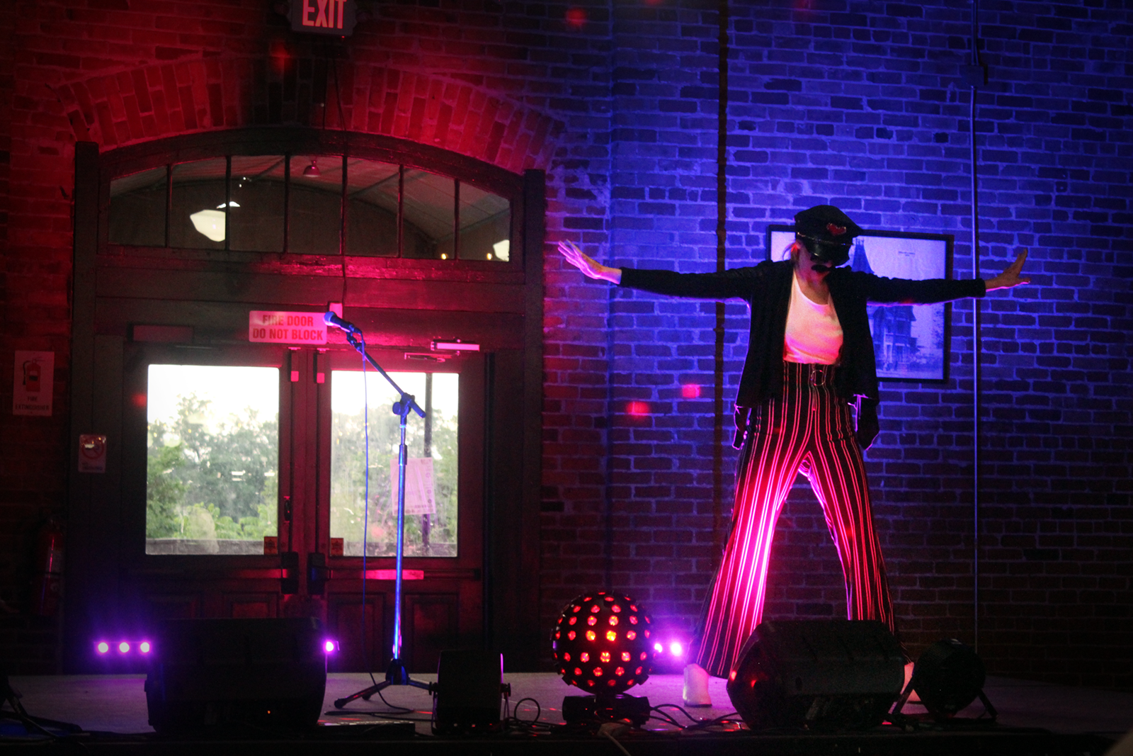 The Freighthouse stage combines comedy and burlesque with a rousing performance of Queen’s "Don’t Stop Me Now," with a performer costumed as Freddie Mercury.