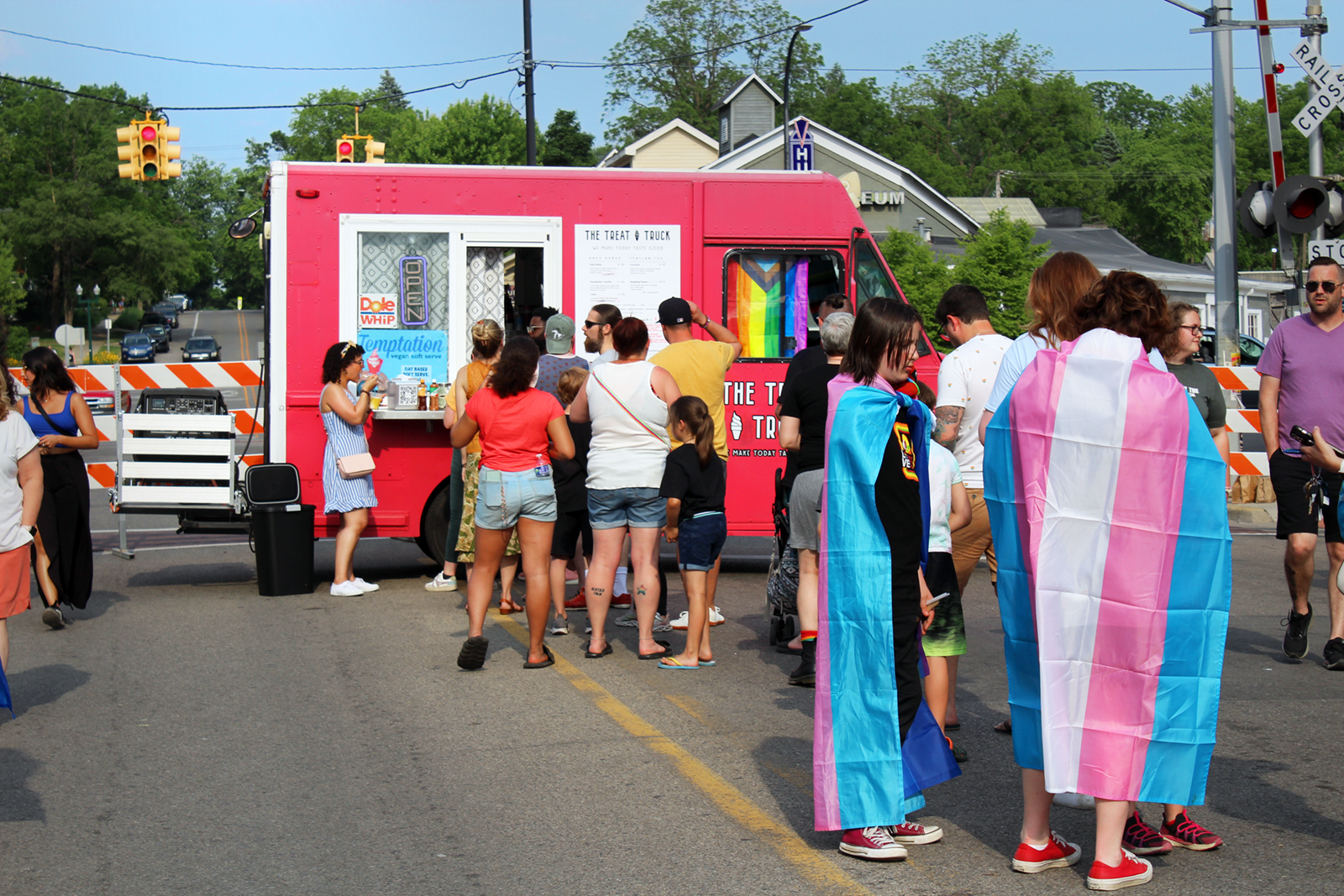 Pride attendees line up at The Treat Truck to beat the heat. The truck offered vegan soft-serve and cool beverages throughout the festival.