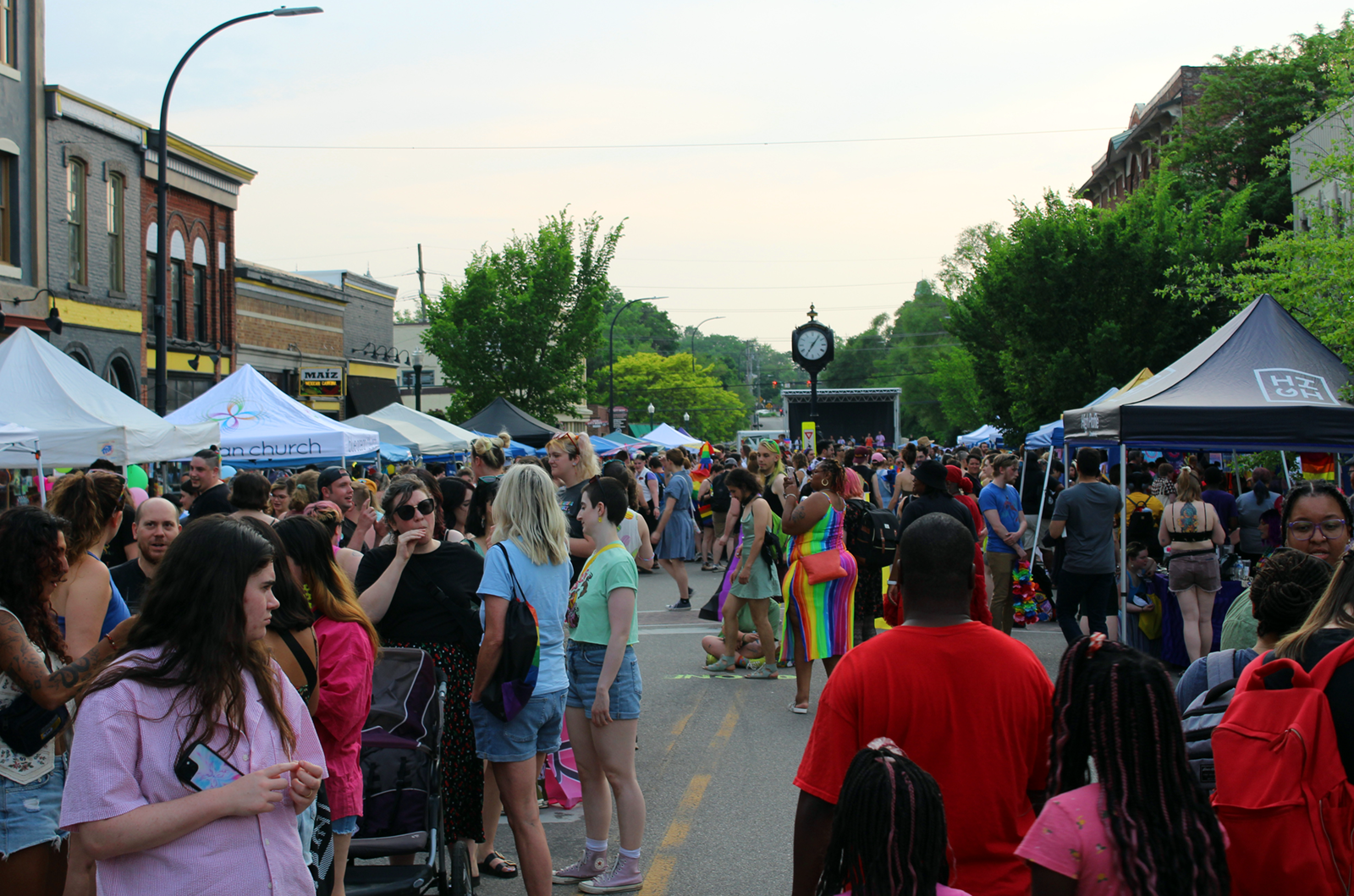 Cross Street fills with vendors and attendants, including Eastern Michigan University’s LGBT Resource Center, Ypsilanti Arts Supply, and Blue Ocean Faith Church Ann Arbor.