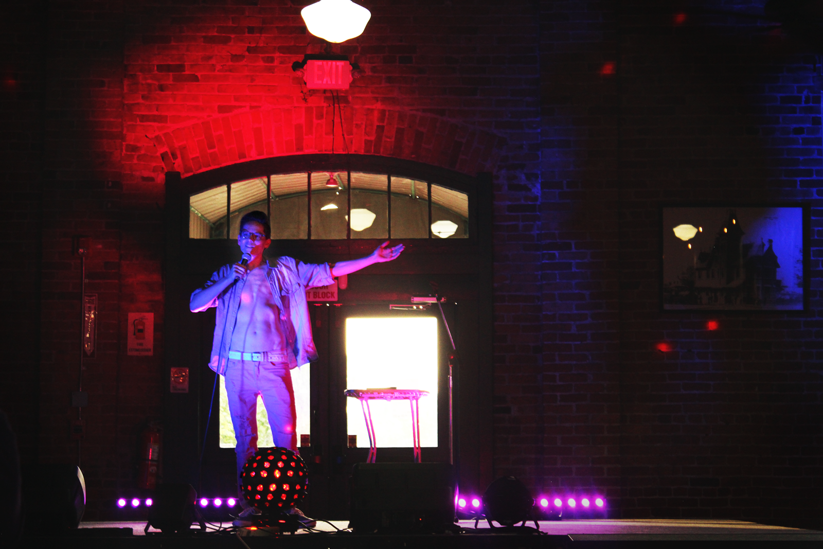 Ann Arbor comedian Finn St. John performs a set at the Freighthouse stage.