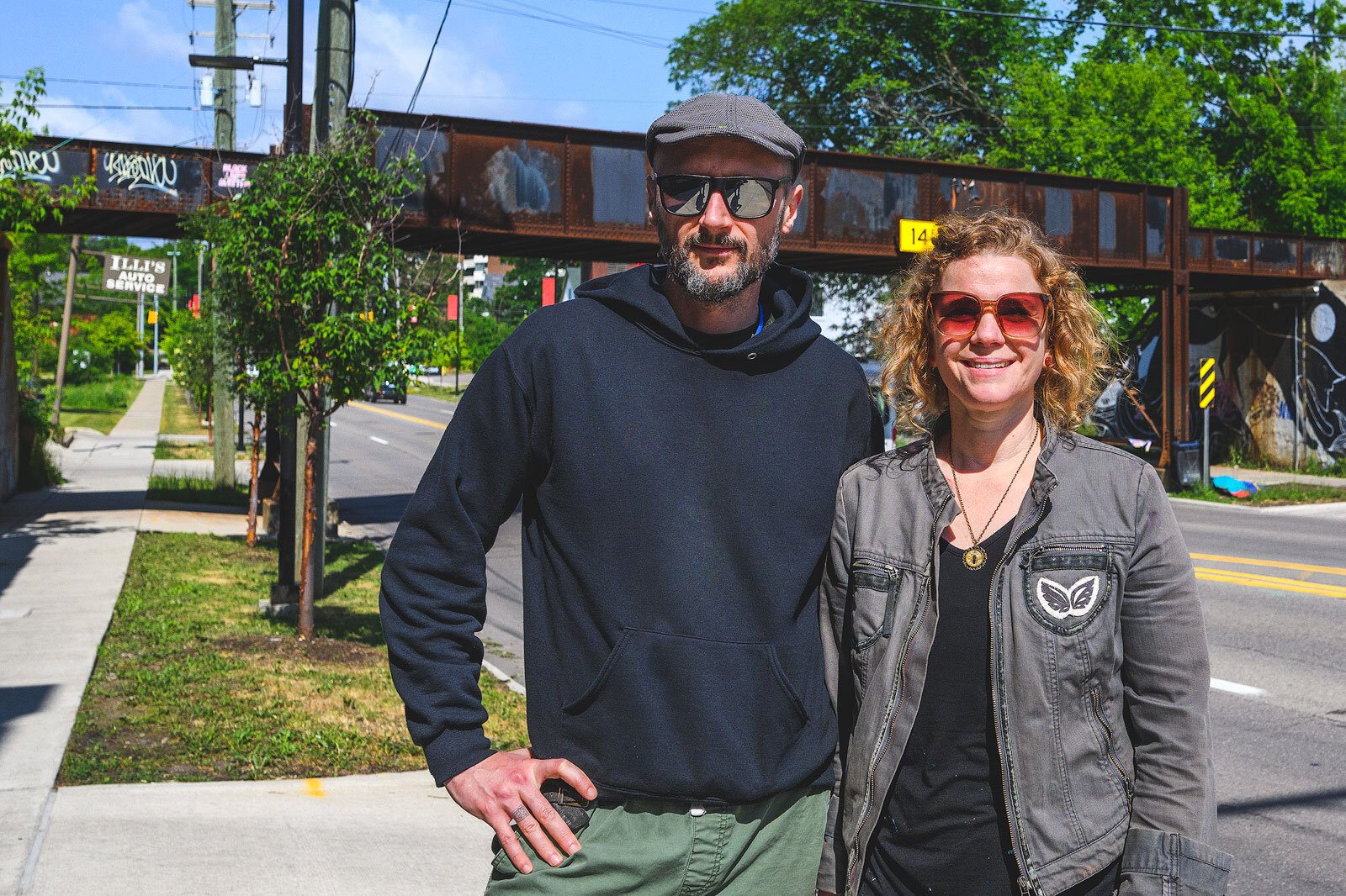 TreeTown Murals' Danijel Matanić and Mary Thiefels at the Huron Street bridge near North First Street.