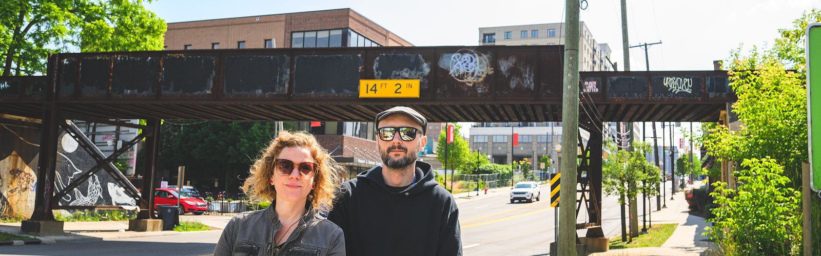 TreeTown Murals' Mary Thiefels and Danijel Matanić by the Huron Street railroad bridge.