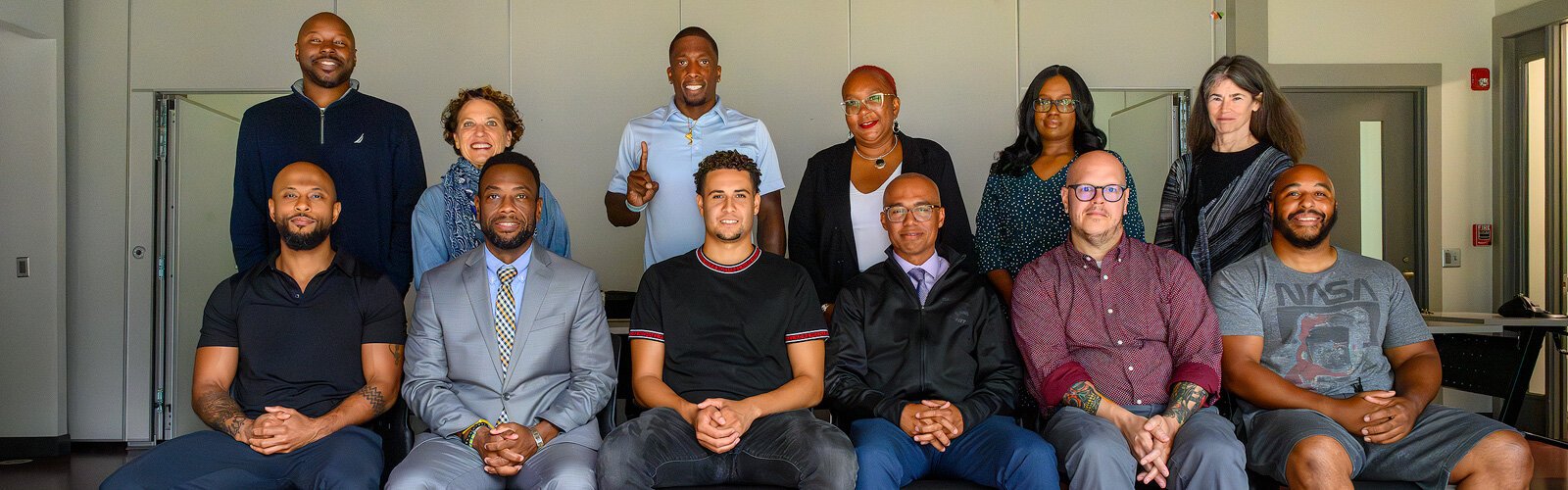 Coalition members (back row L to R) Jamall Bufford, Lori Bennett, Deshawn Leeth, Cherisa Allen, Pamela Tooson, Jamie Abelson; (front row) Kiyoshi Shelton, Ché Carter, Jackson Greenstone, Derrick Jackson, Corey Telin, and Justin Harper at Ozone House.