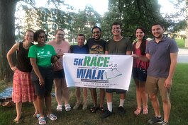 EMU students promote the Elijah and Chase 5K in 2022.