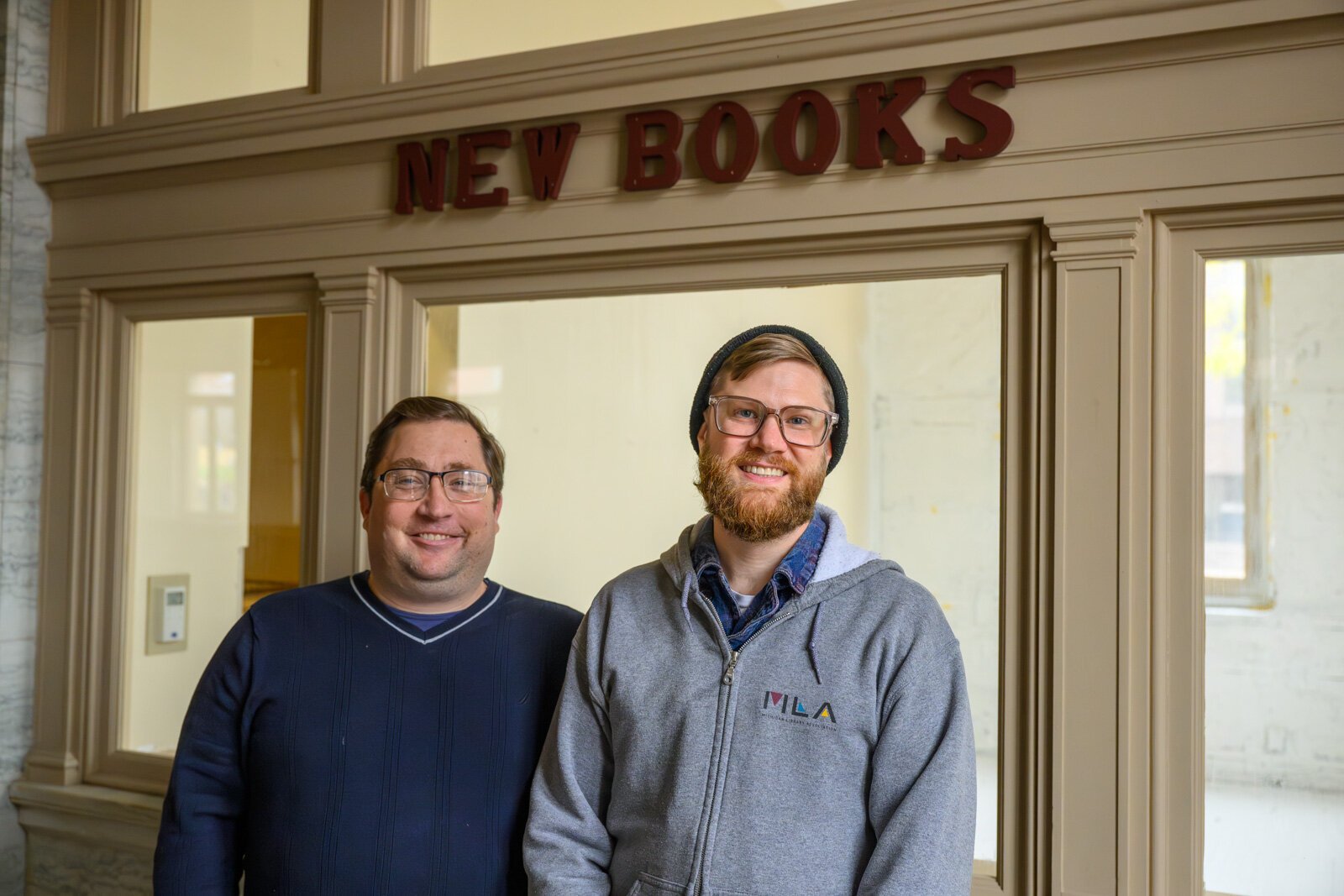 Sam Killian and Aaron Smith on the ground floor of the YDL Michigan Avenue branch during remediation.