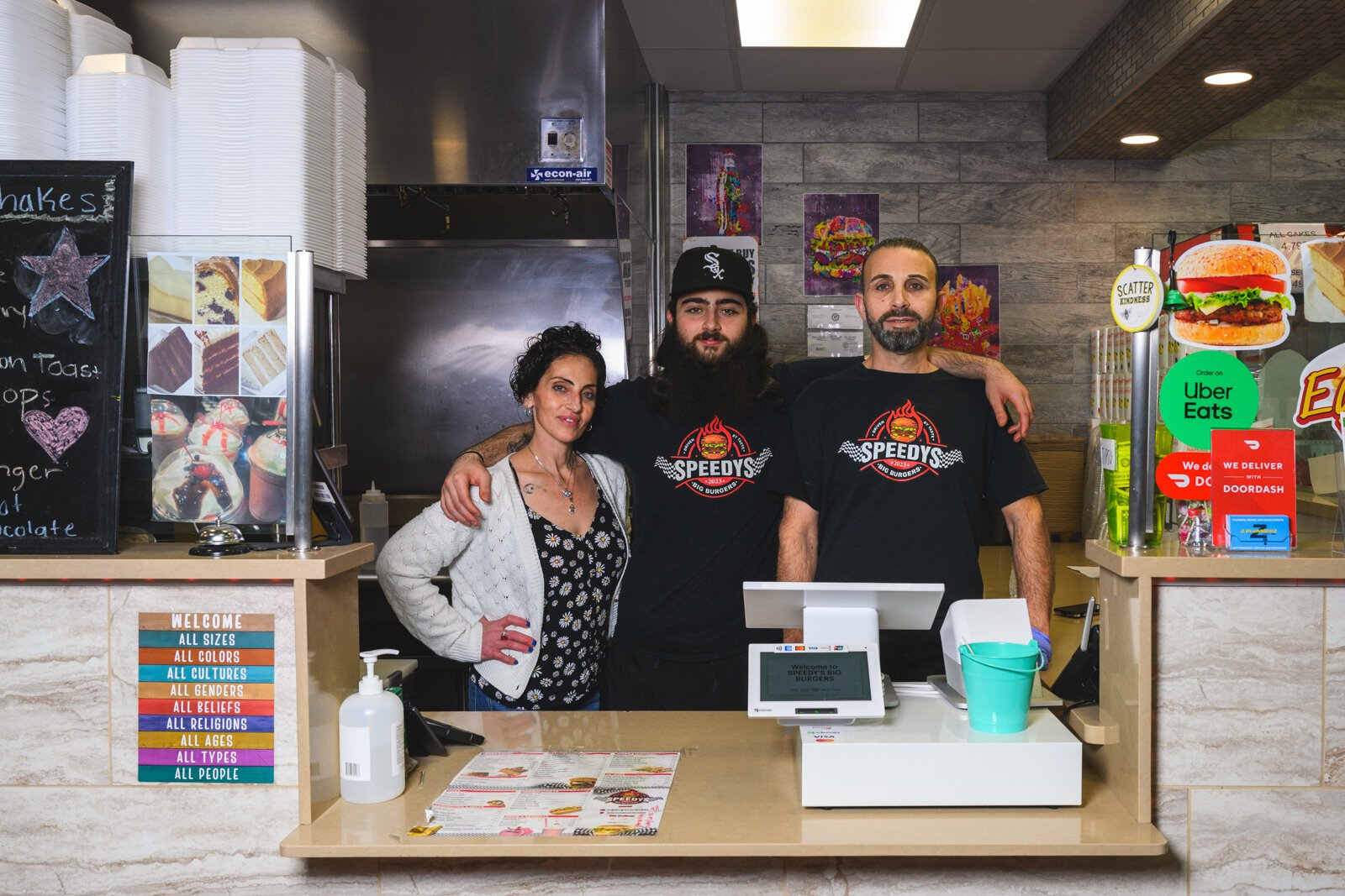 Naj Hammoud (center) with his mother Amy and his father Tee at Speedy's Big Burgers.