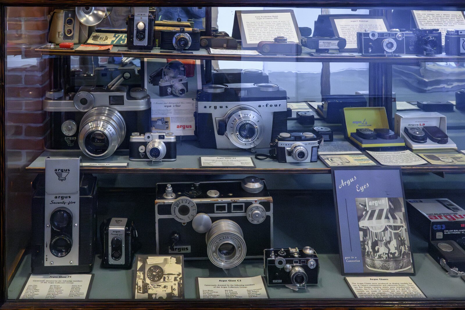 Argus cameras and large display models at the Argus Museum.