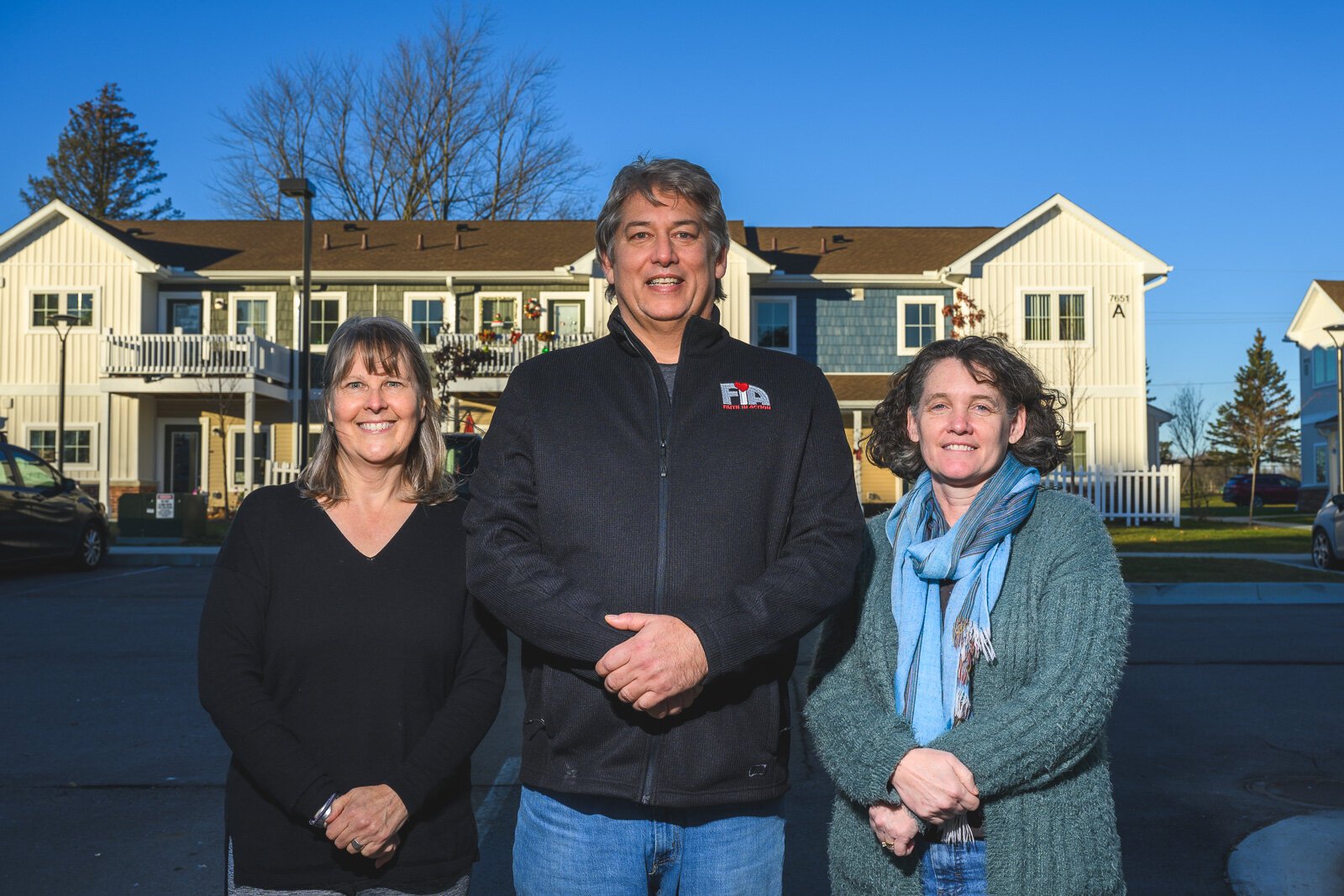 Sarah Shugart, Craig Rafail, and Wendy Carty-Saxon at Hilltop View Apartments.