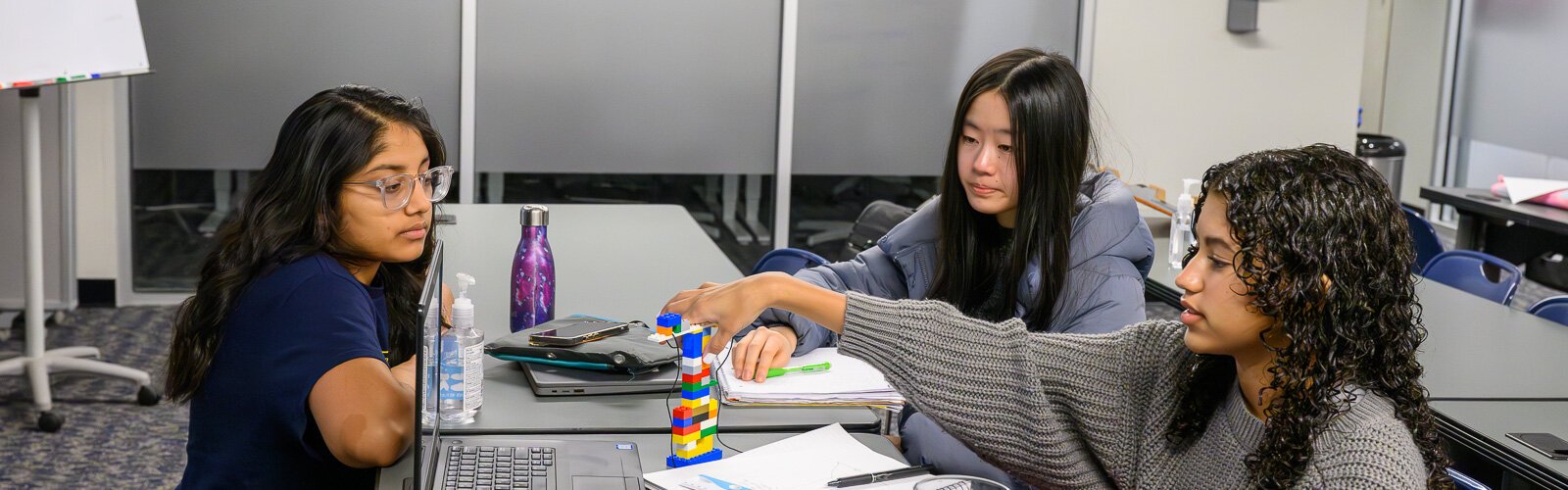 Suahni Dalela (left) helping out at an InvenTeam meeting at SPARK East.