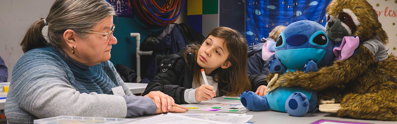 Mary Cayton tutoring a student at Erickson Elementary.