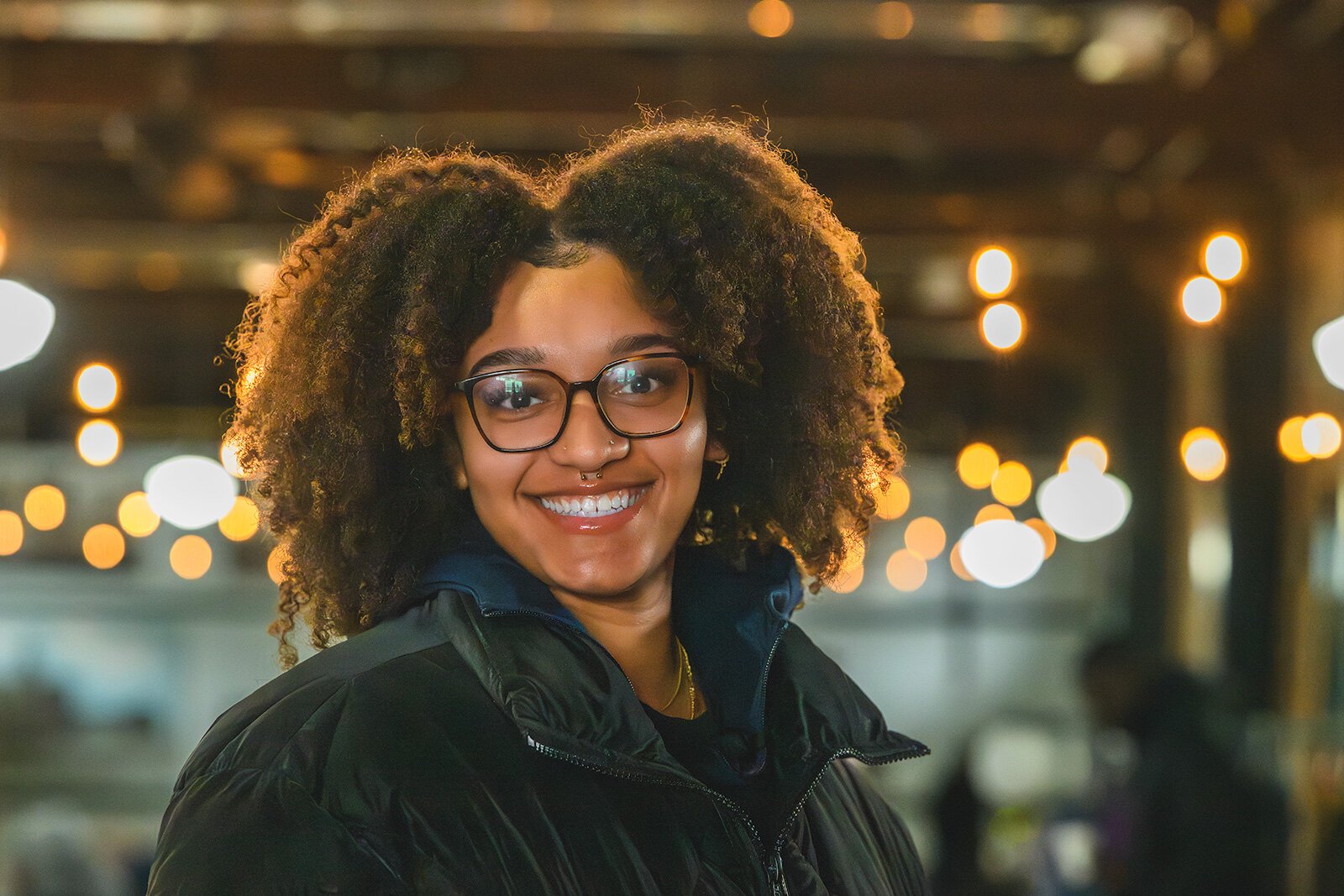 WashUp Ministries intern Amari Aaron at the Ypsilanti Freighthouse.