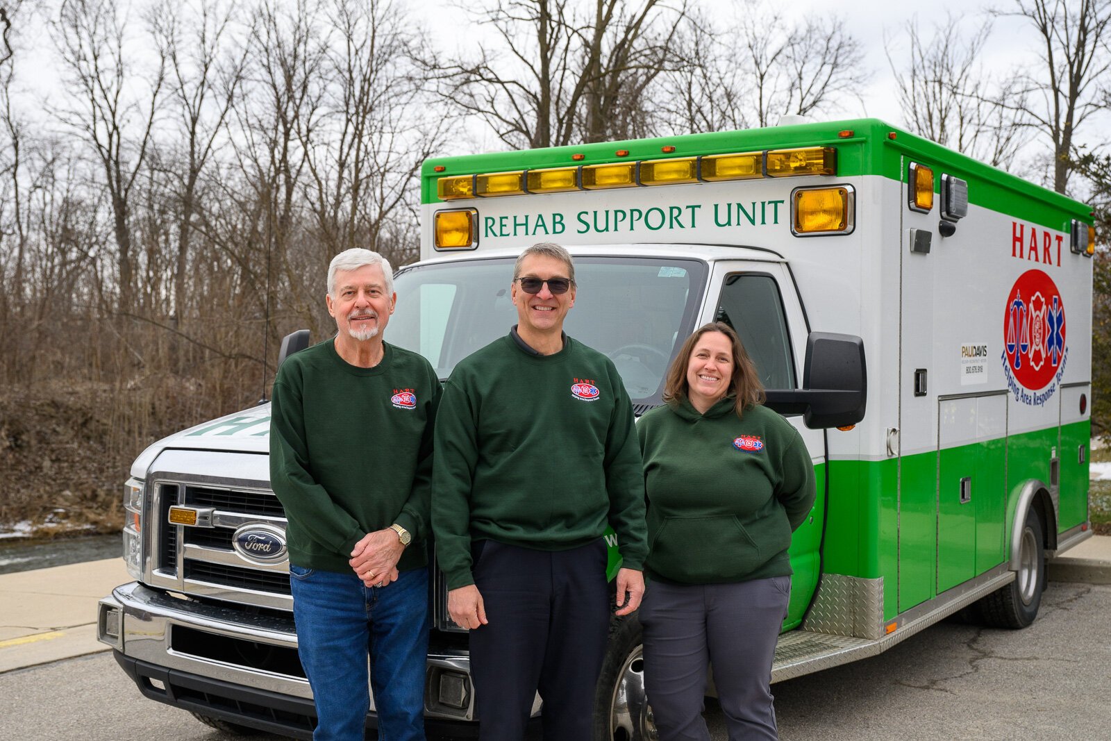 Roger Simpson, Doug Armstrong, and Emily East with the HART van.