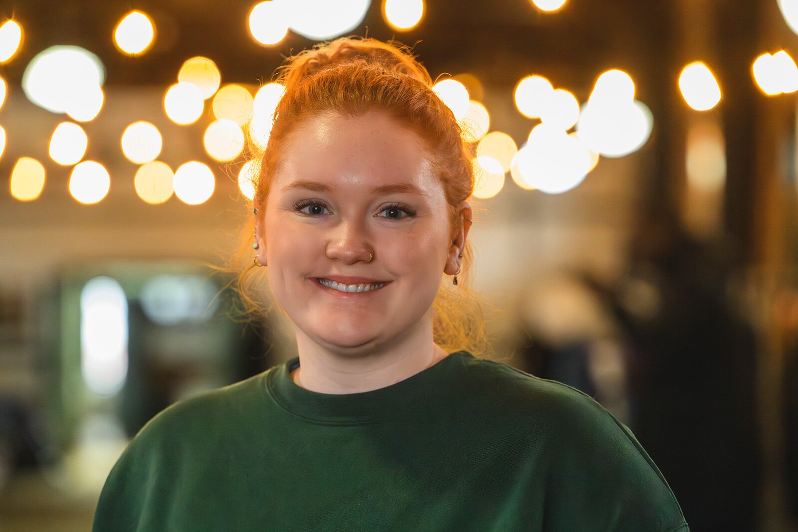 WashUp Ministries intern Kate Holcomb at the Ypsilanti Freighthouse.