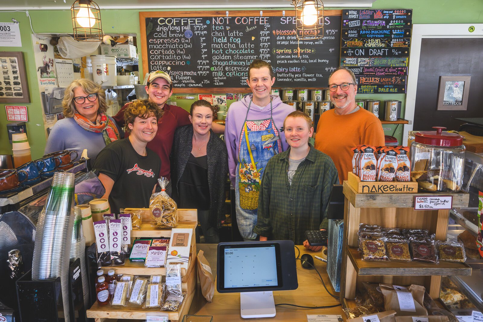 Argus Farm Stop owners Kathy Sample and Bill Brinkerhoff with the staff at their Liberty Street location.