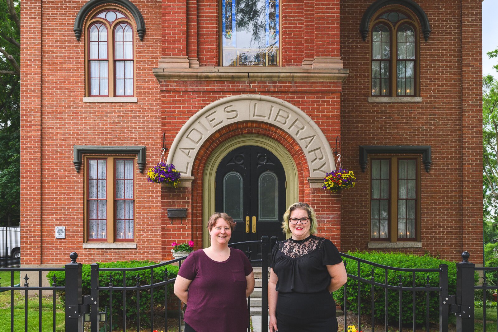 Crysta Coburn and Kay Gray at The Ladies Library building in Ypsilanti.