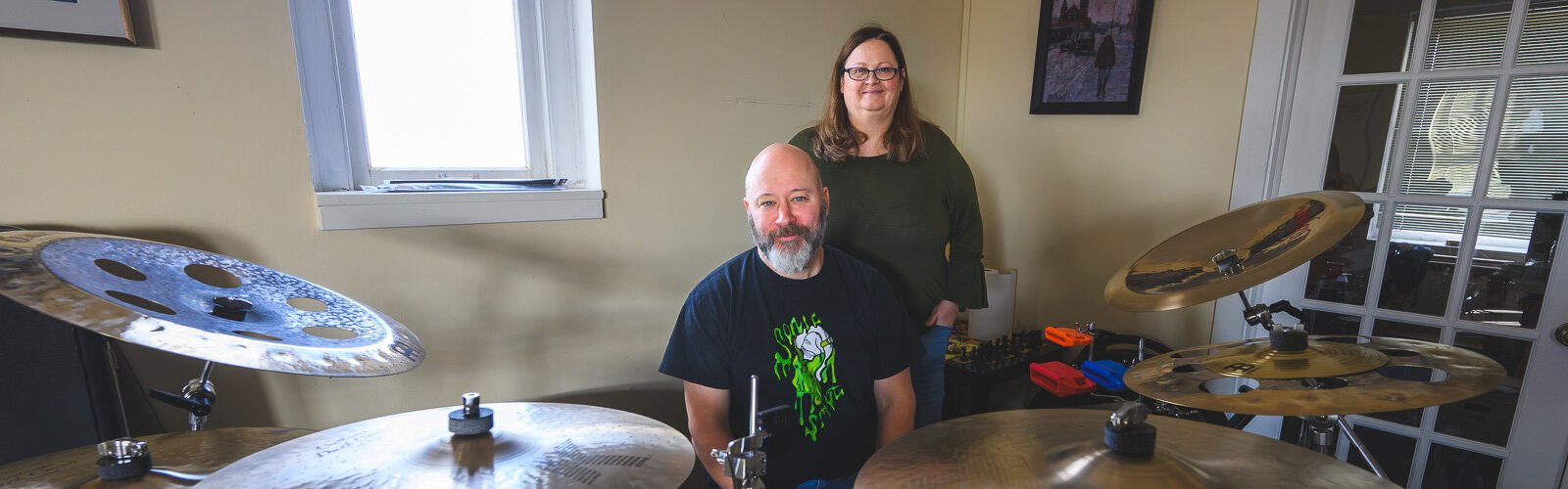 "The Drumbeat with Josie and Pete" podcast hosts Peter Martel and Josie Ann Lee.