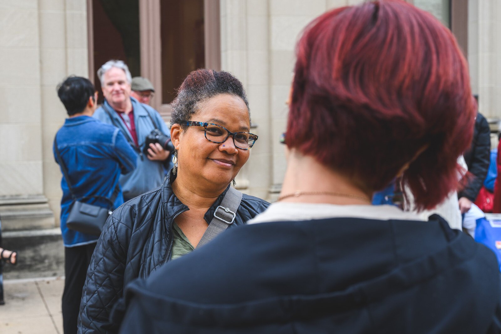 People gathering at the Ypsilanti District Library Michigan Avenue branch before A Great Day in Ypsi photo shoot.