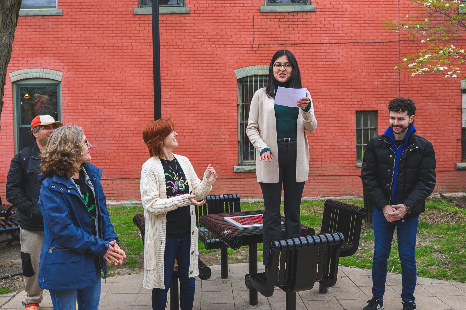 Angelica Esquivel speaking before the Great Day in Ypsi photo shoot.
