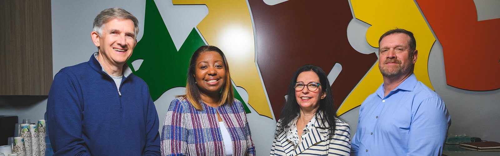 Ann Arbor Area Community Foundation CFO Jamie Hunter, President and CEO Shannon Polk, Impact Investing Manager Frances Todoro-Hargreaves, and Vice President for Community Investment Christopher Lemon.