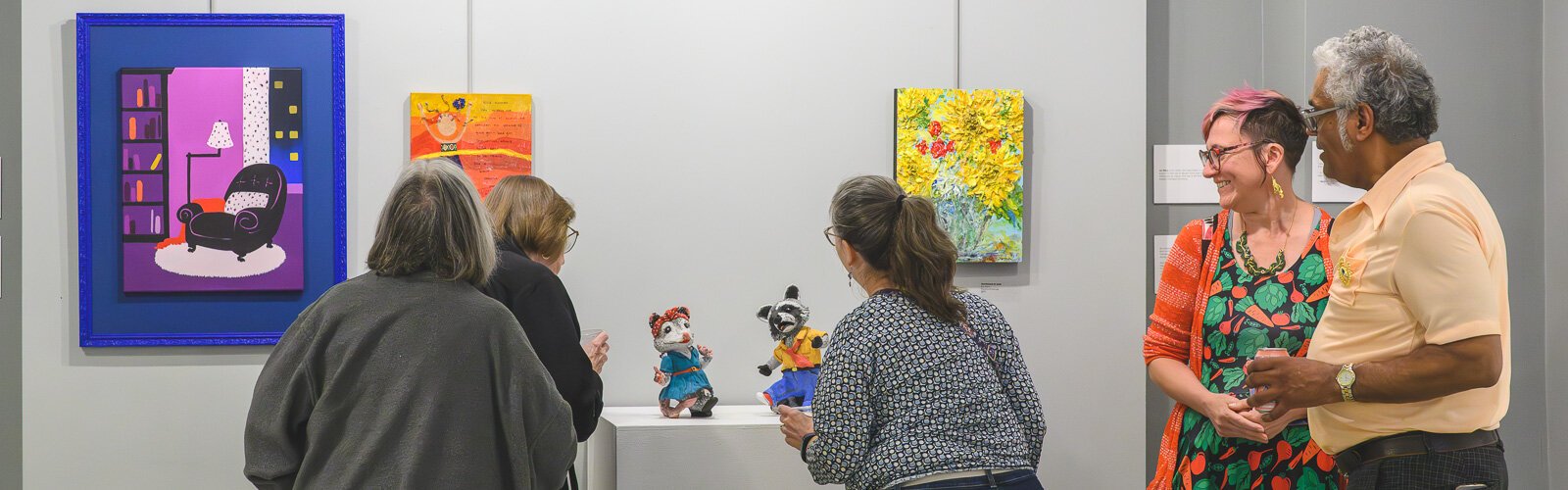 Attendees at "Share: An Ypsi Fine Arts Club Exhibition," which spotlighted club members' work from April 18-May 16, 2025, at Riverside Arts Center in Ypsilanti.