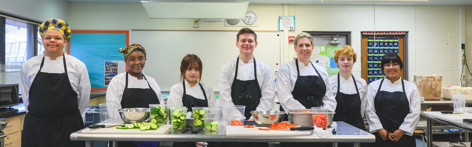 Students in Huron High School's Culinary and Hospitality class, with instructor Samantha Dye third from right.