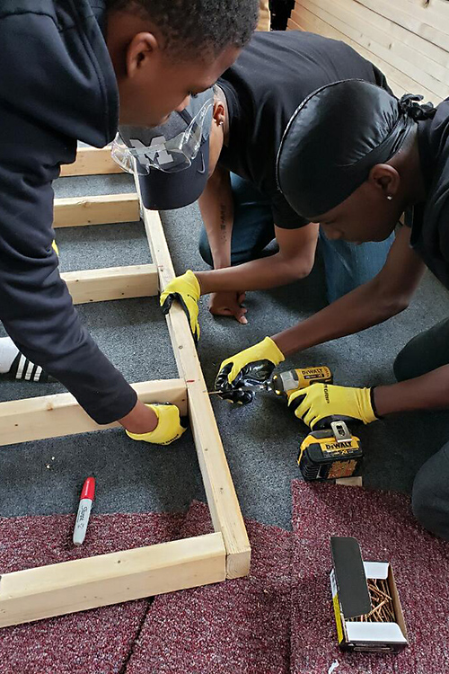 Local youth working on the Parkridge Community Center recording studio.