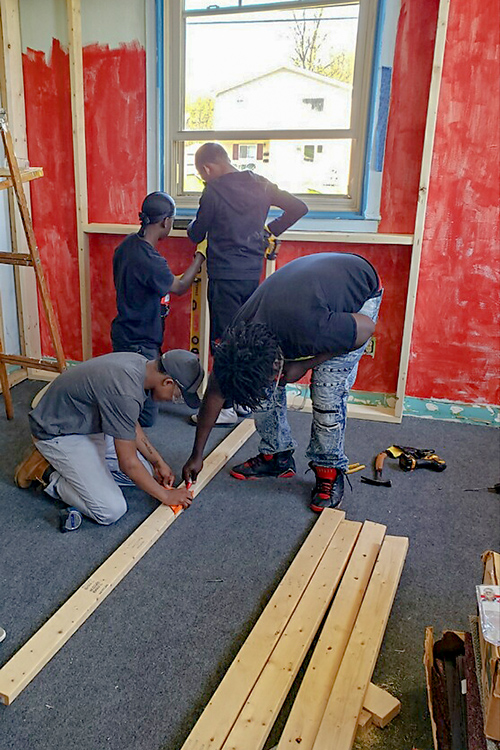 Local youth working on the Parkridge Community Center recording studio.