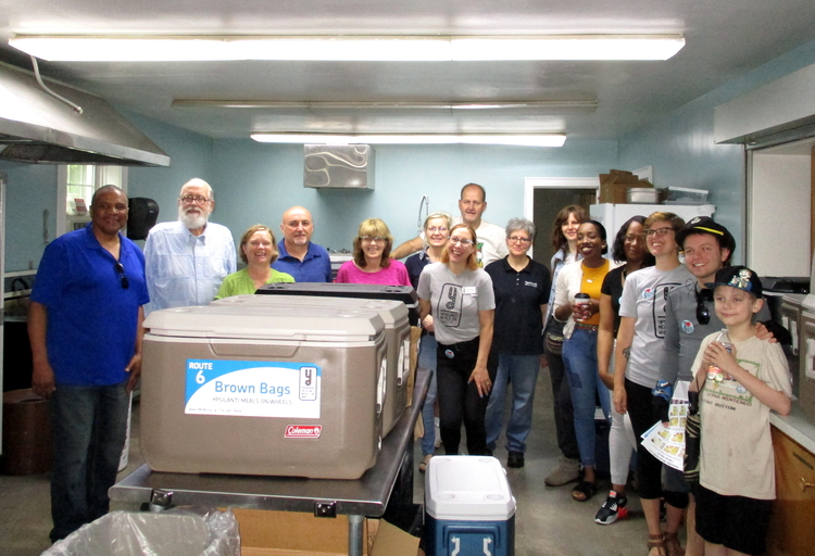 YMOW staff and volunteers gather in the kitchen at First Baptist Church before making their first Saturday delivery in 14 years.