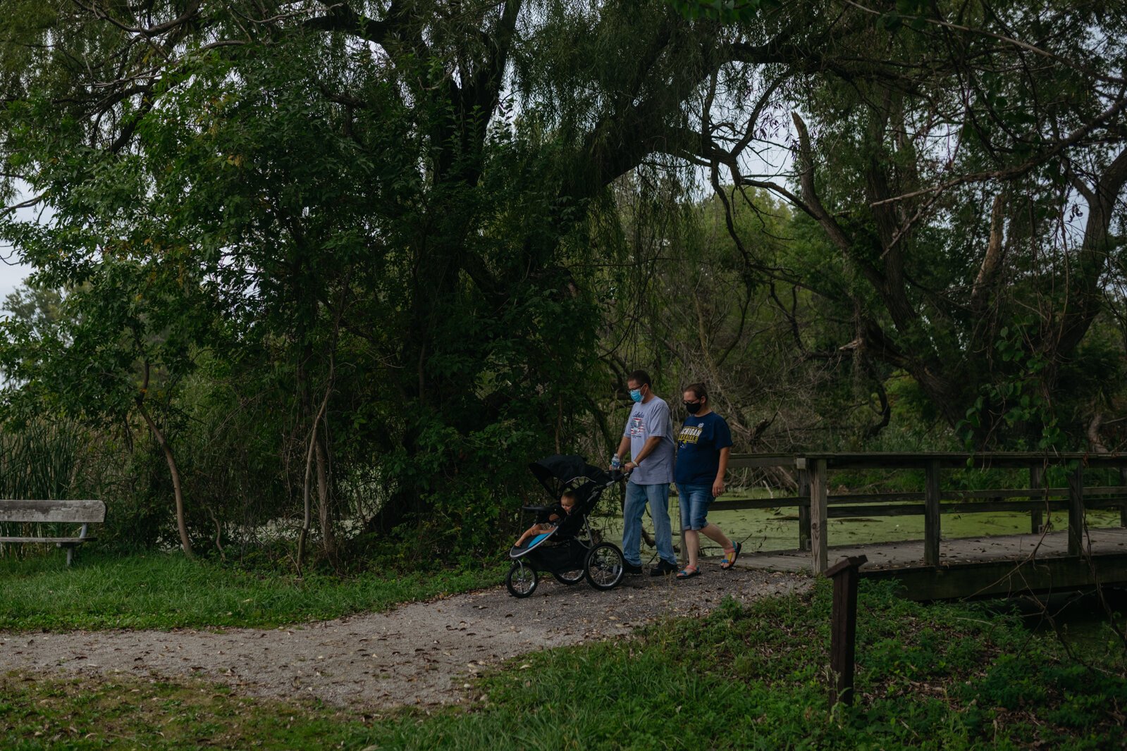 People walk at Lake St. Clair Metropark.