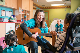 Blythe Filar plays music with patients