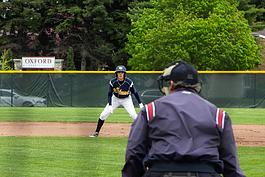 Noah Koster, a member of the Mount Pleasant High School Varsity Baseball Team, attempts to steal a base during the team’s game against Arthur Hill High School on May 20, 2019.
