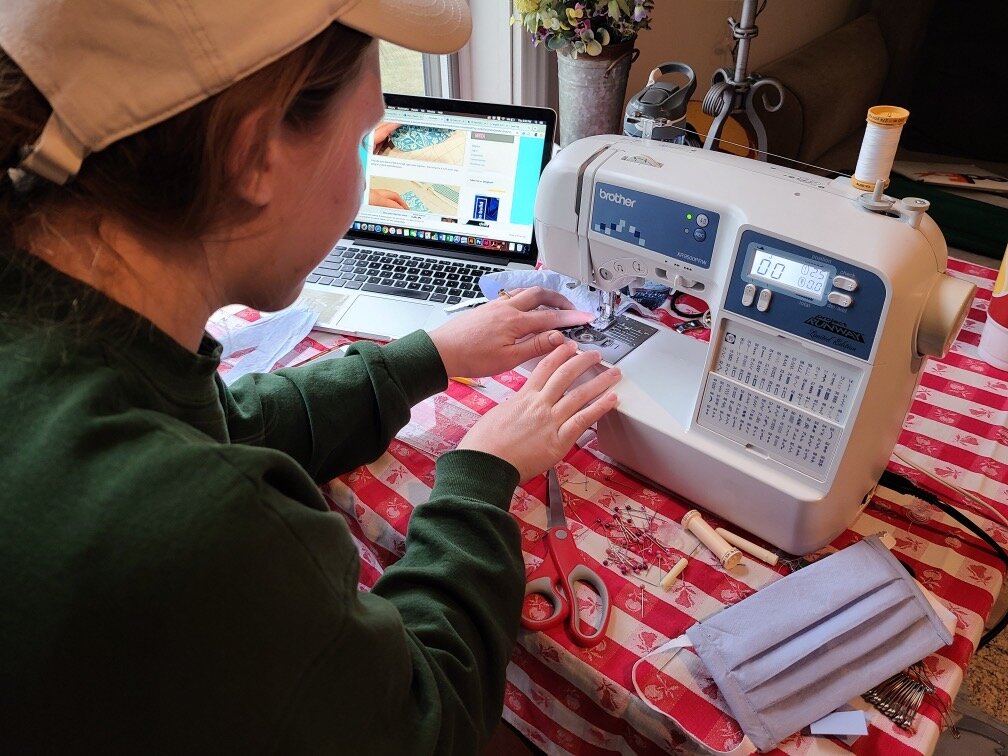 Kensi Desimpelare, a CMU senior from Frankenmuth, is using an assembly line process to quickly create masks.